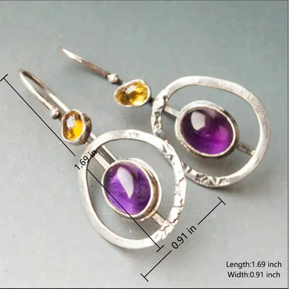 Éclat des Étoiles : Boucles d'Oreilles Boho en Cristal Saturn Violet avec Monture Argentée