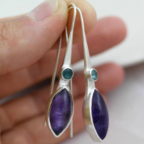 Éblouissantes boucles d'oreilles mauves en argent sterling